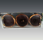 Black walnut cookies tray epoxy gilding with clear epoxy base and gold handles, showcasing three walnut slices.