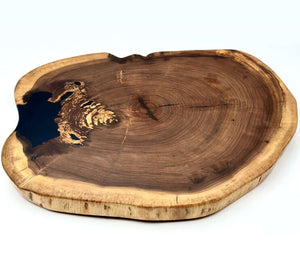 live edge black walnut lazy susan showcasing rich grain and unique shape, perfect for serving and display.