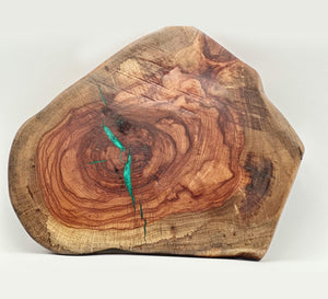 live edge pecan lazy susan featuring turquoise epoxy accents and natural wood grain.