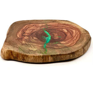 Live edge pecan lazy susan featuring turquoise epoxy accents and natural wood grain.