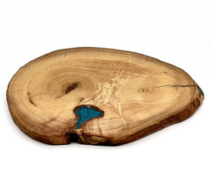 Live edge wood cookie showcasing natural grain and unique design, ideal for live edge wood centerpieces and serving.