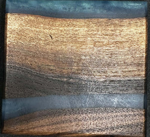 Black walnut coasters with blue epoxy showcasing rich wood grains and vibrant epoxy inlays.