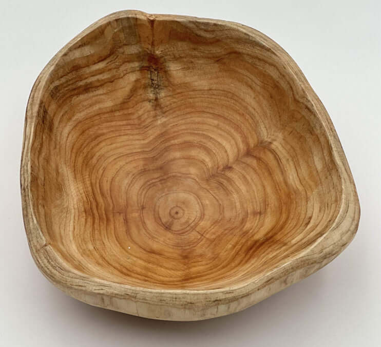 Handcrafted cedar live edge bowls showcasing unique grains and warm tones of solid wood.