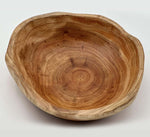 Handcrafted cedar live edge bowls showcasing unique grain patterns and natural warmth.