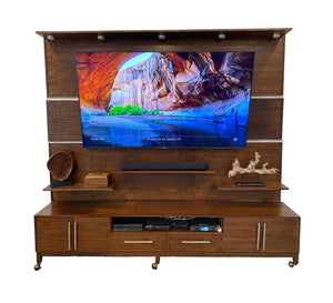 Handcrafted walnut entertainment center featuring a modern design with spacious storage for media components.