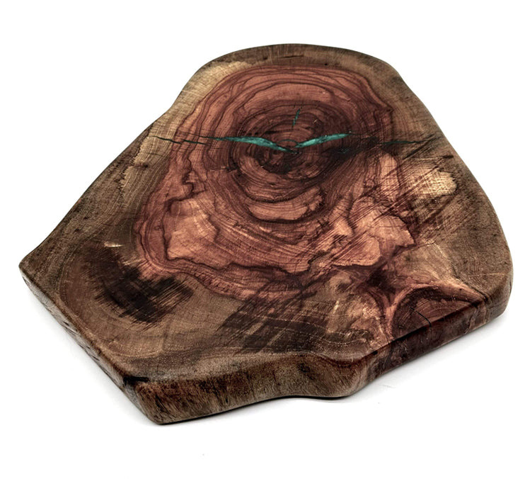 Live edge pecan lazy susan highlighting natural grain and turquoise epoxy accents.