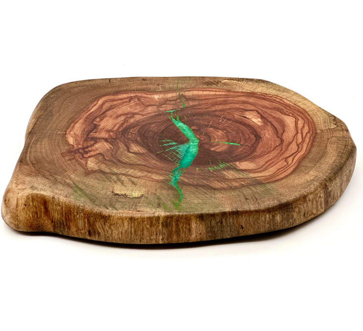 Live edge pecan lazy susan featuring turquoise epoxy accents and natural wood grain.
