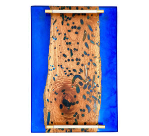 ocean blue live edge epoxy tray with natural wood grain and deep blue epoxy details