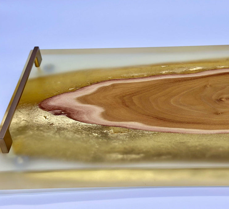 Live edge epoxy serving tray featuring Osage orange wood and gold gilding with clear epoxy finish.